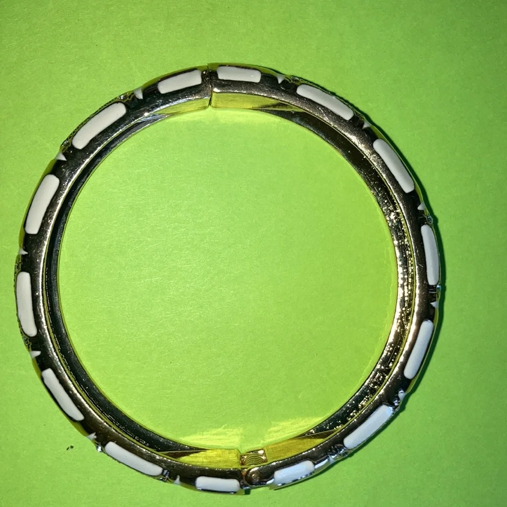 NWOT hinged rd. bracelet w/white enamel between gold designs. $25 - Picture 4 of 6
